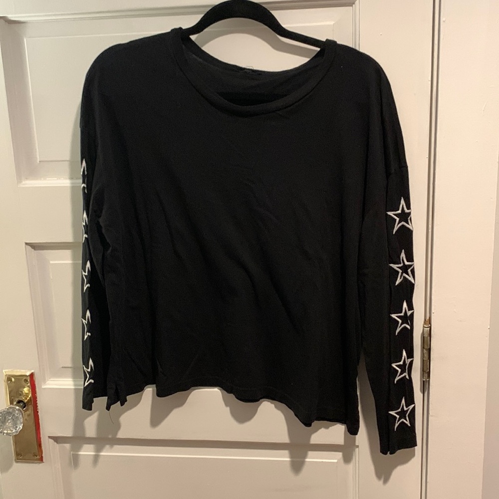 Black long sleeve with white stars down both arms